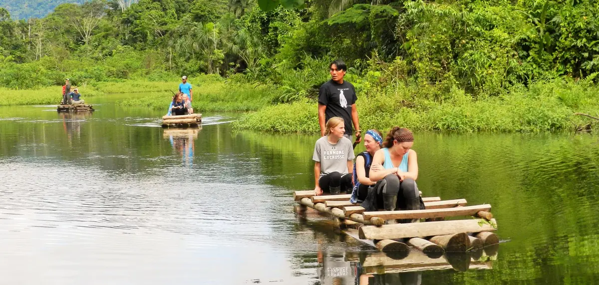 Spanish students on a river excursion in Manu National Park, Peru